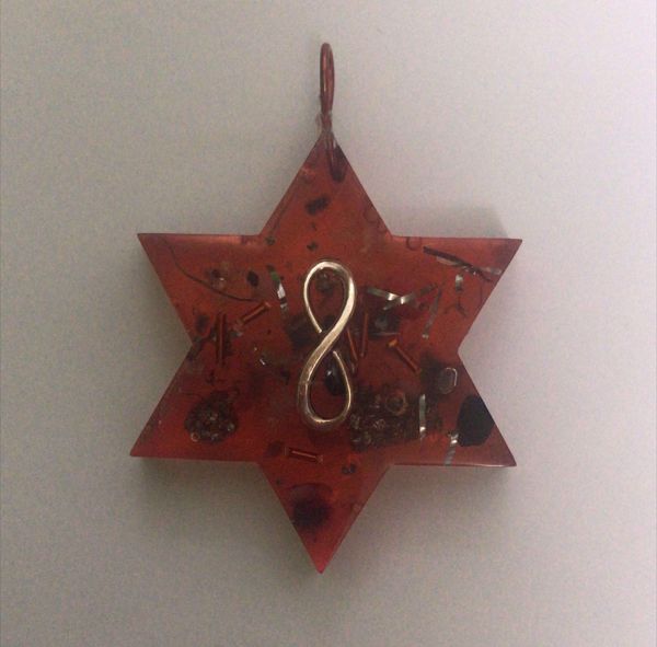 Imagen de COLGANTE ORGONITA ESTRELLA INFINITO 5X6 CMS