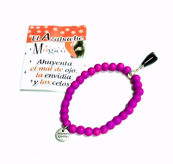 Imagen de Pulsera mano higa negra. Bolas de caucho violeta fosforito. Puño cerrado.