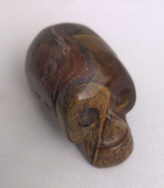 Imagen de AMULETO CALAVERA OJO TIGRE 4.5 X 2.3 CM